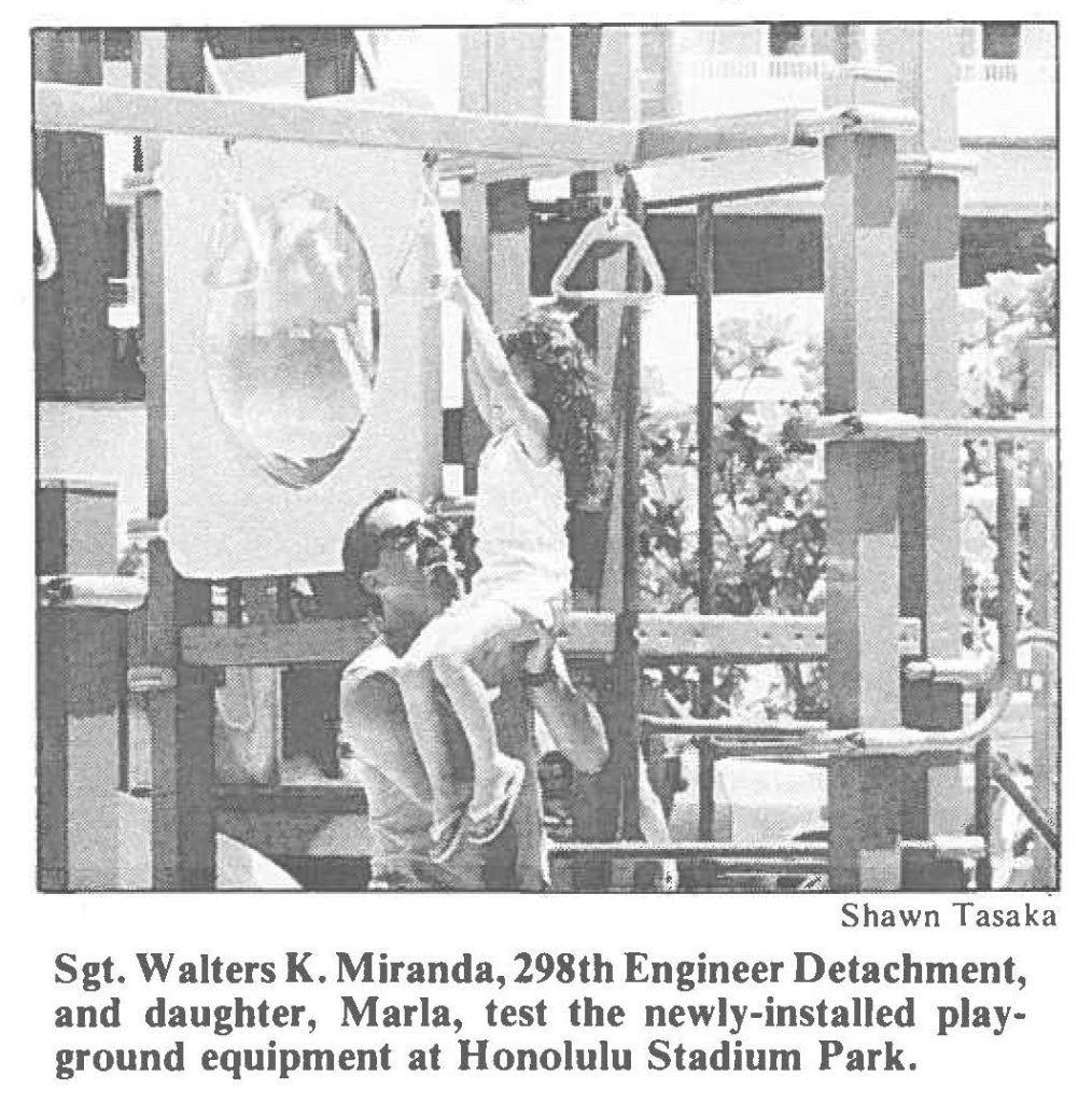 Sgt. Walters K. Miranda, 298th Engineer Detachment, and daughter, Marla, test the newly-installed playground equipment at Honolulu Stadium Park.