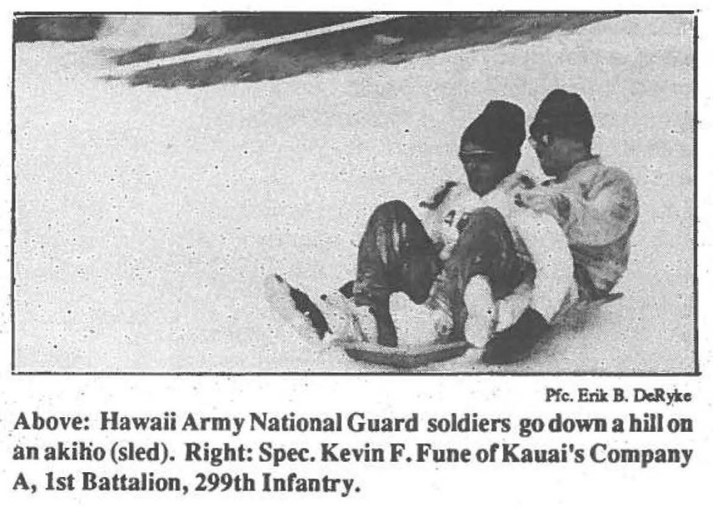 Above: Hawaii Army National Guard soldiers go down a hill on an akihio (sled).