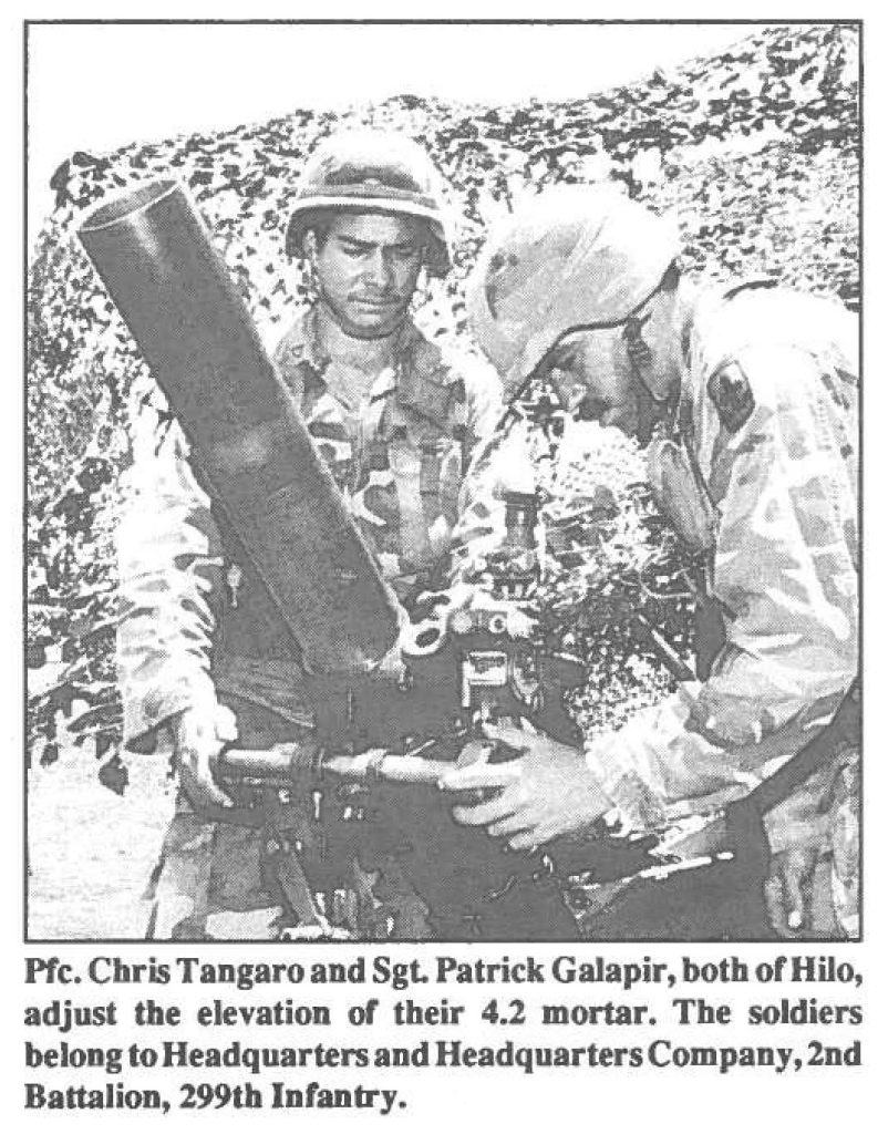 Pfc. Chris Tangaro and Sgt. Patrick Galapir, both of Hilo, adjust the elevation or their 4.2 mortar. The soldiers belong to Headquarters and Headquarters Company, 2nd Battalion, 299th Infantry.