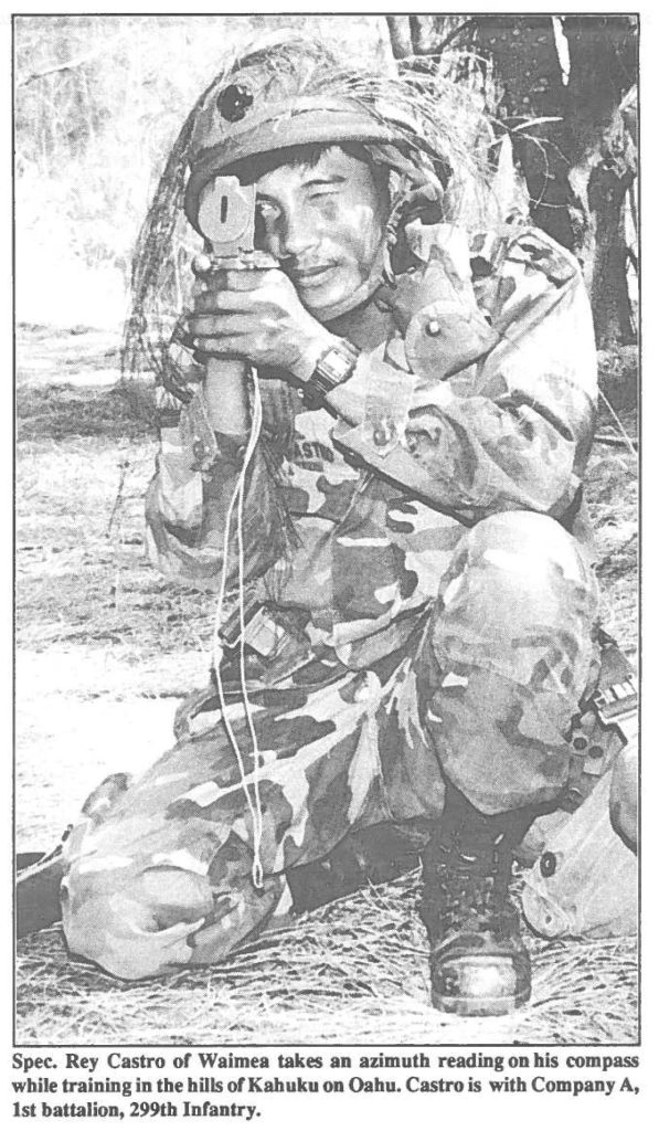 Spec. Rey Castro of Waimea takes an azimuth reading on his compass while training in the bills of Kabuku on Oahu. Castro is with Company A, 1st battalion, 299th Infantry.