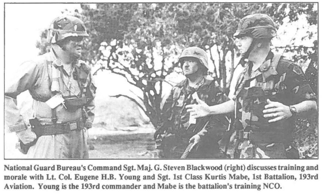 National Guard Bureau's Command Sgt. Maj. G. Steven Blackwood (right) discusses training and morale with Lt. Col. Eugene H.B. Young and Sgt. 1st Class Kurtis Mabe, 1st Battalion, 193rd Aviation. Young is the 193rd commander and Mabe is the battalion's training NCO.