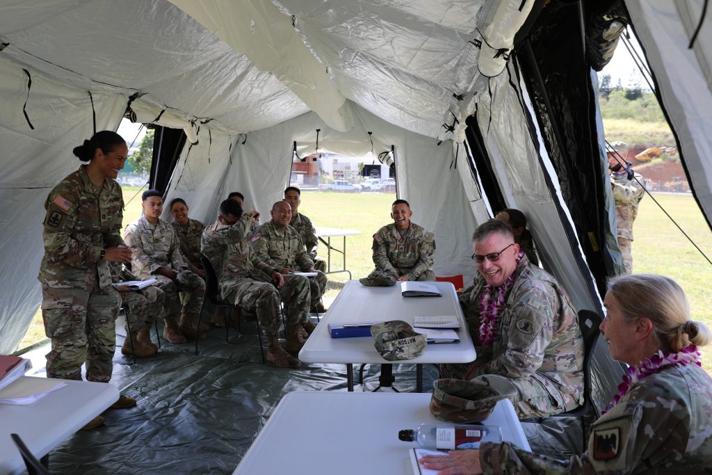 Hawaii Army National Guard, Capt. Linsey L. Alcantara, the commander assigned to Bravo Company, 1109th Theater Aviation Sustainment Maintenance Group (TASMG), 103rd Troop Command, gives a brief during the Philip A. Connelly competition at Pearl City, Hawaii, June 2, 2022. The competition includes all aspects of food preparation, safe execution, and sanitation. (U.S. Army National Guard photo by Spc. Bethany Cravalho)