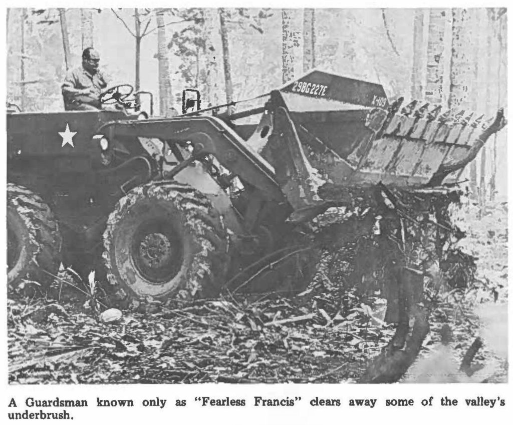A Guardsman known only as "Fearless Francis" clears away some of the valley's underbrush.