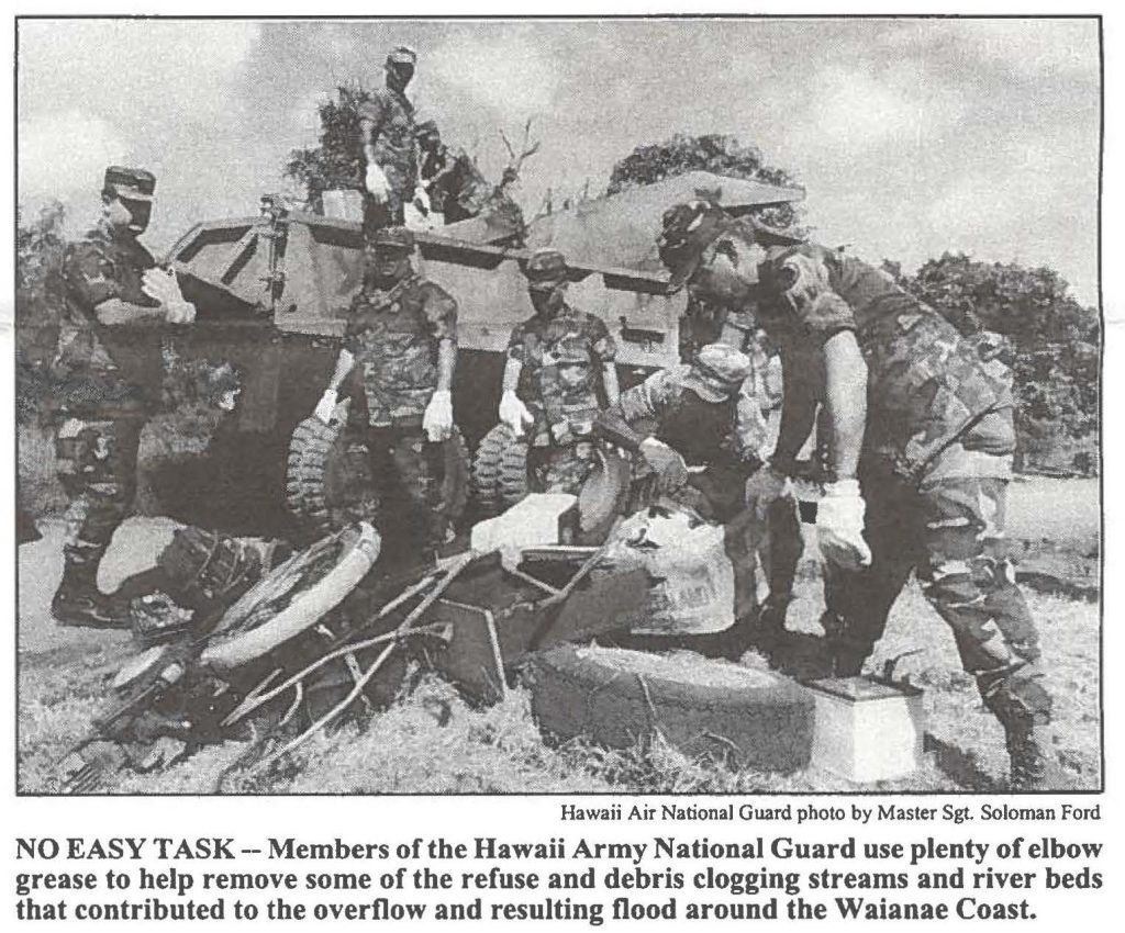 NO EASY TASK -- Members of the Hawaii Army National Guard use plenty of elbow grease to help remove some of the refuse and debris clogging streams and river beds that contributed to the overflow and resulting flood around the Waianae Coast.
