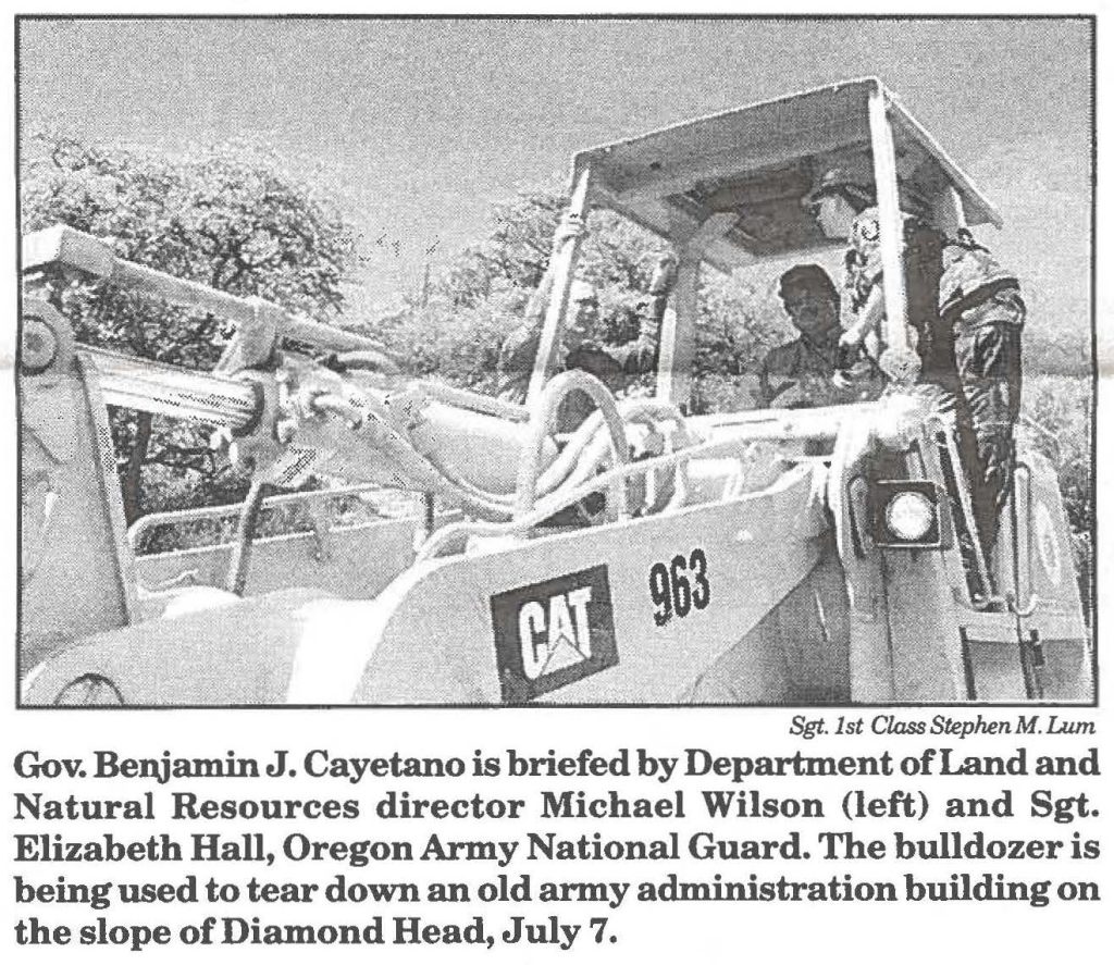 Gov. Benjamin J. Cayetano is briefed by Department of Land and Natural Resources director Michael Wilson (left) and Sgt. Elizabeth Hall, Oregon Army National Guard. The bulldozer is being used to tear down an old army administration building on the slope of Diamond Head, July 7.