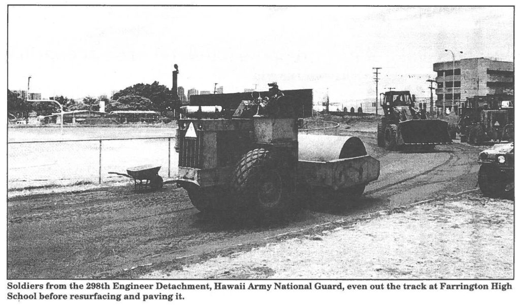 Soldiers from the 298th Engineer Detachment, Hawaii Army National Guard, even out the track at Farrington High School before resurfacing and paving it.