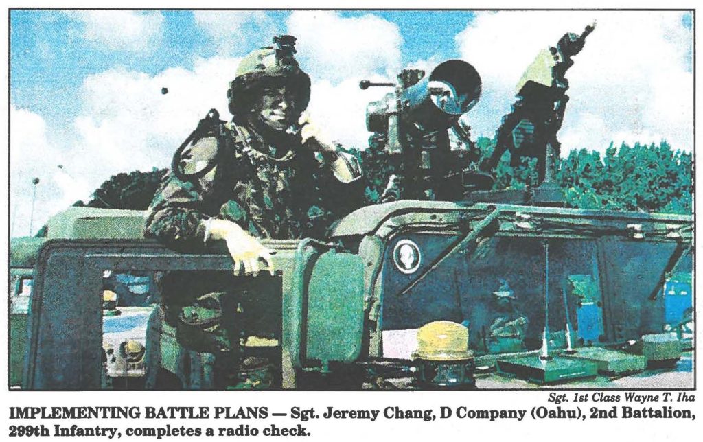IMPLEMENTING BATTLE PLANS - Sgt. Jeremy Chang, D Company (Oahu), 2nd Battalion, 299th Infantry, completes a radio check.
