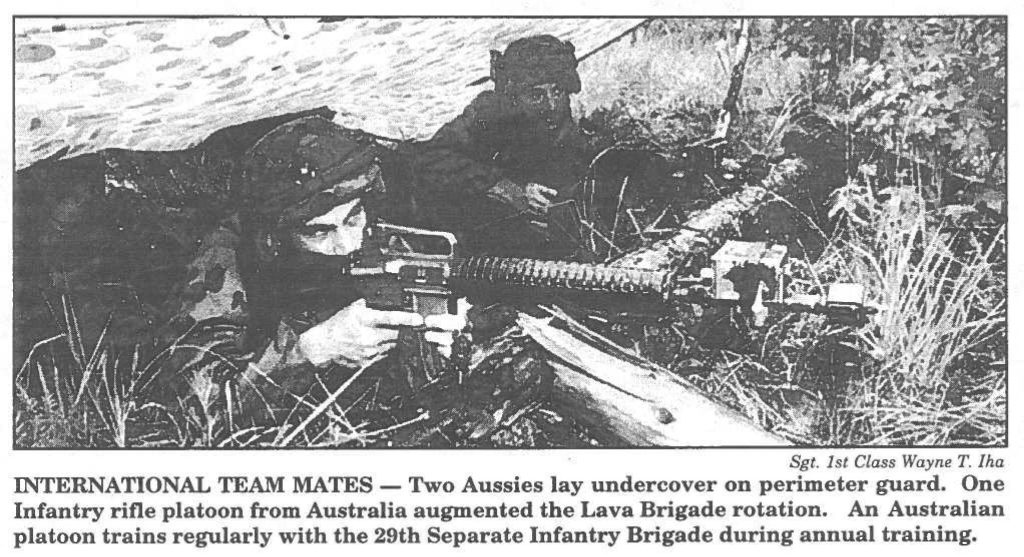 INTERNATIONAL TEAM MATES - Two Aussies lay undercover on perimeter guard. One Infantry rifle platoon from Australia augmented the Lava Brigade rotation. An Australian platoon trains regularly with the 29th Separate Infantry Brigade during annual training.