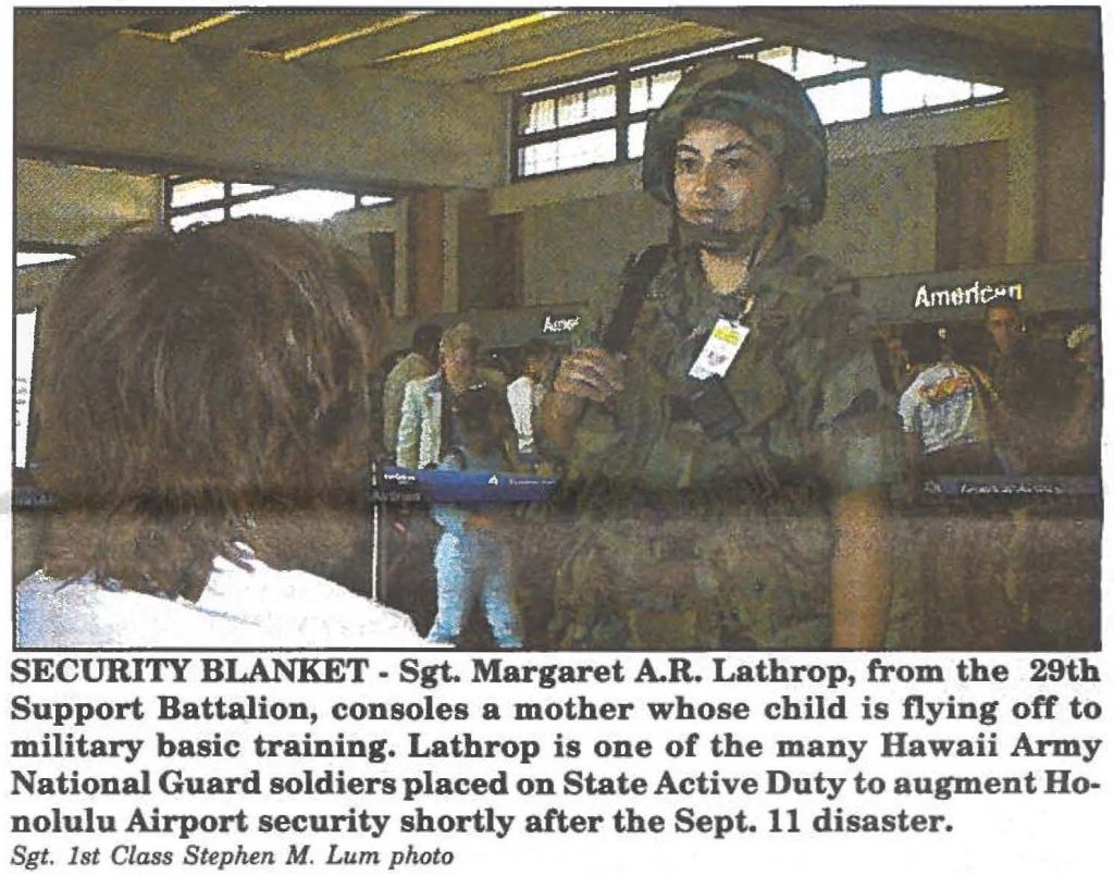 SECURITY BLANKET . Sgt. Margaret A.R. Lathrop, from the 29th Support Battalion, consoles a mother whose child is flying off to military basic training. Lathrop is one of the many Hawaii Army National Guard soldiers placed on State Active Duty to augment Honolulu Airport security shortly after the Sept. 11 disaster. Sgt. 1st Class Step/um M. Lum photo