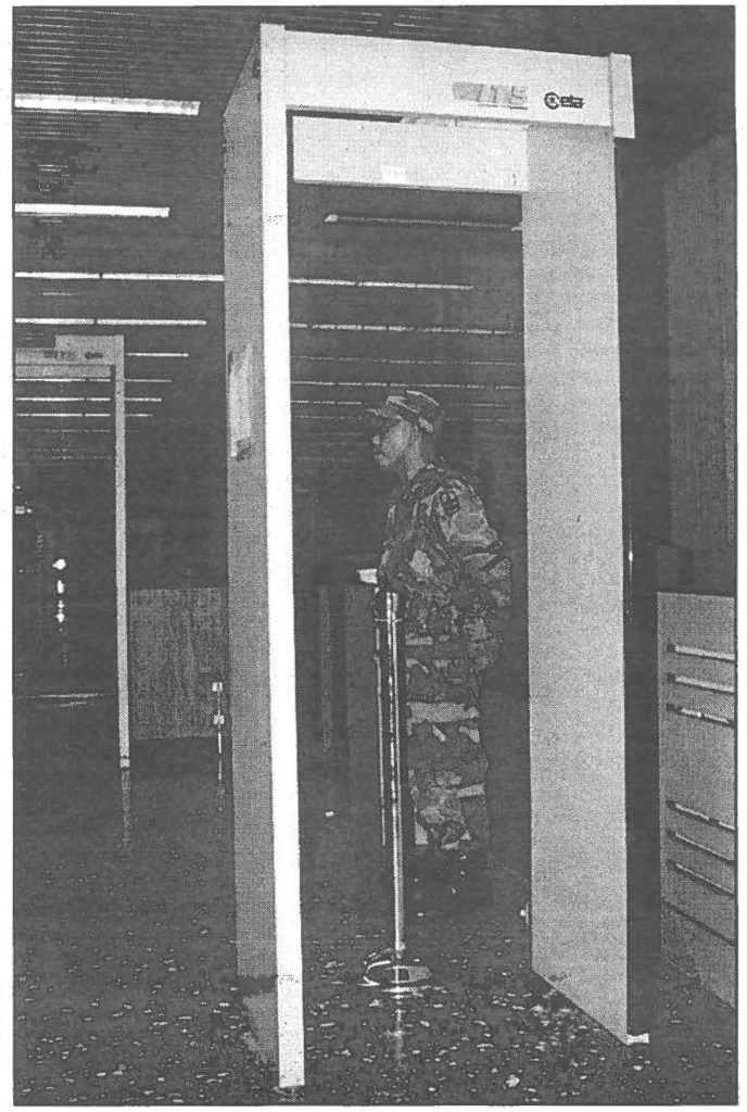 HOMELAND DEFENDER--A 1st Battalion, 487th Field Artillery soldier stands guard at the Honolulu International Airport passenger security sensor.