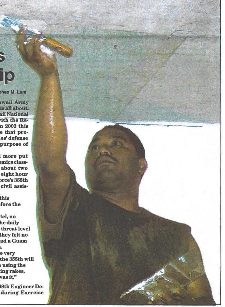 PAINTING THE CEILING-- Spc. Andrew Kalaukoa, 298th Engineer Detachment, places "mud" to seal the ceiling joints during Exercise Balikatan in the Philippines.