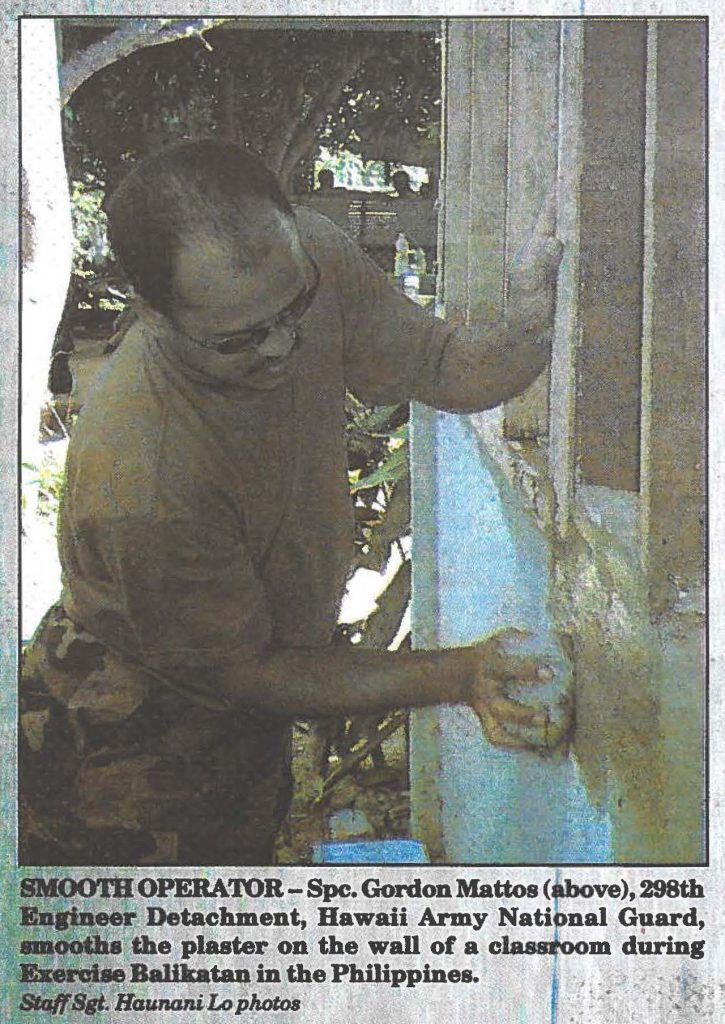 SMOOTH OPERATOR - Spc. Gordon Mattos, 298th Engineer Detachment, Hawaii Army National Guard, smooths the plaster on the wall of a classroom during Exercise Balikatan in the Philippines. Staff Sgt. Haunani Lo Photos