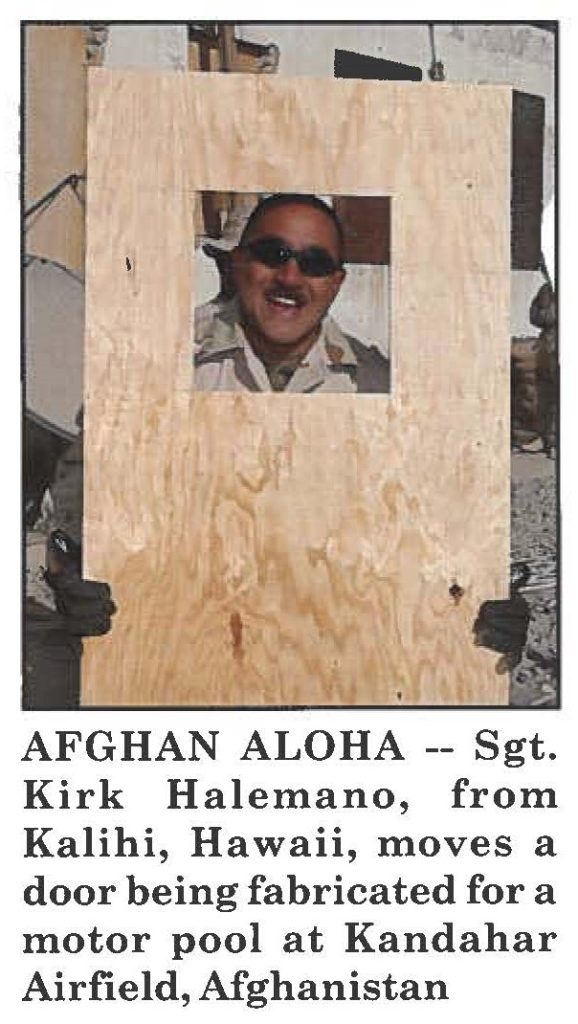 AFGHAN ALOHA -- Sgt. Kirk Halemano, from Kalihi, Hawaii, moves a door being fabricated for a motor pool at Kandahar Airfield, Afghanistan