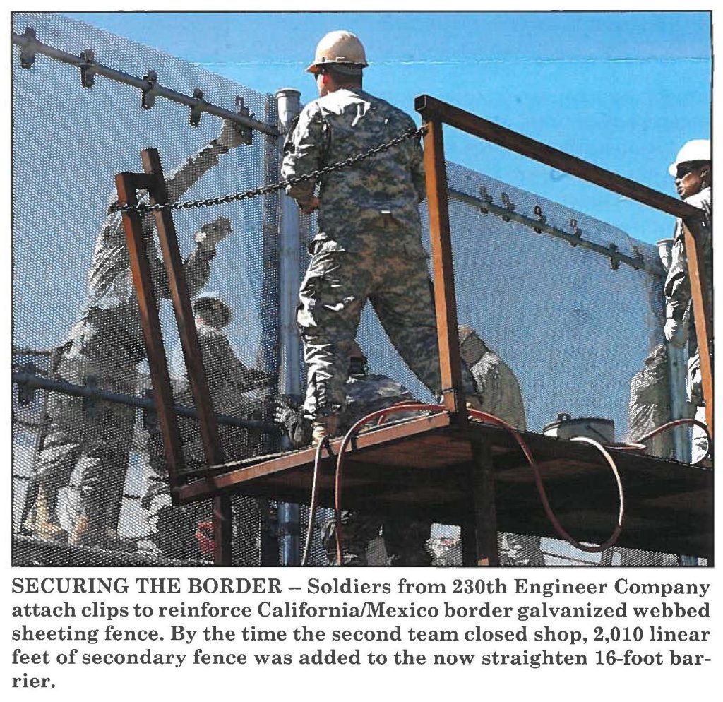 SECURING THE BORDER - Soldiers from 230th Engineer Company attach clips to reinforce California / Mexico border galvanized webbed sheeting fence. By the time the second team closed shop, 2,010 linear feet of secondary fence was added to the now straighten 16-foot barrier.