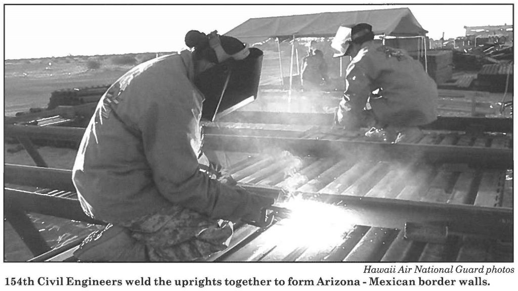 154th Civil Engineers weld the uprights together to form Arizona - Mexican border walls.