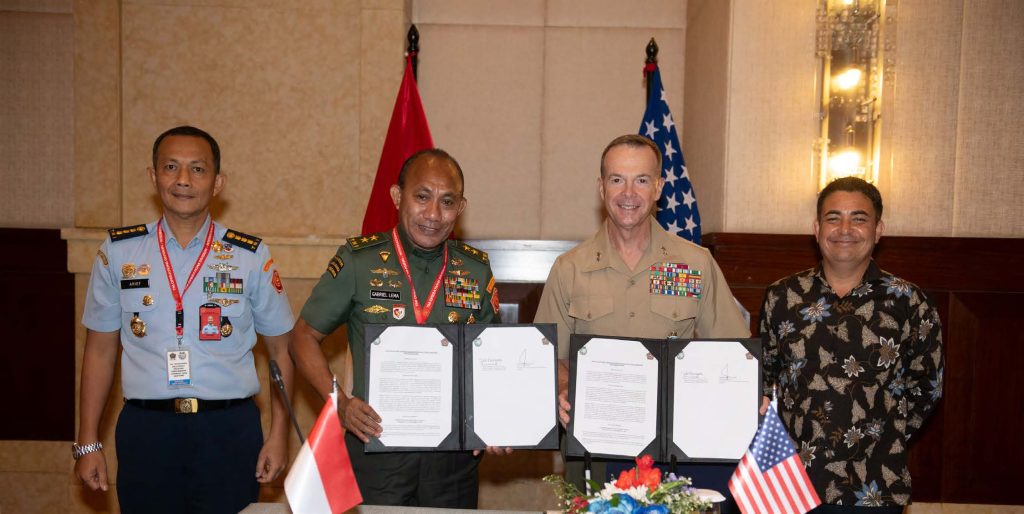 Tentara Nasional Indonesia leaders of the 2025 Bilateral Defense Discussions, Col. Arief Budiman, Maj. Gen. Gabriel Lema, S.SOS, and their equivalent counterparts from U.S. Indo-Pacific Command, U.S. Marine Corps Maj. Gen. Jay Bargeron and Brandon Torres, present the minutes collected throughout the event on Jan. 24, 2025, in Jakarta, Indonesia. The finalized documents reflect key agreements on interoperability, training exchanges, and long-term strategic cooperation between the two nations. (U.S. Air National Guard photo by Tech. Sgt. John Linzmeier)