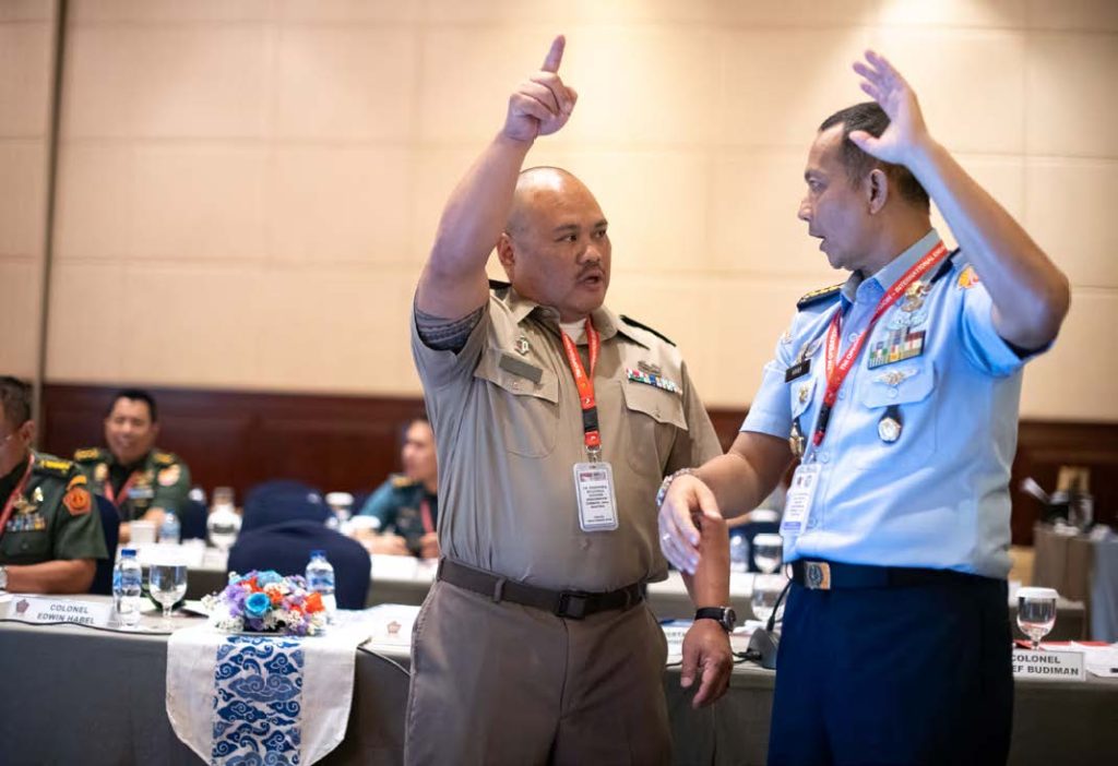 Tentara Nasional Indonesia leaders of the 2025 Bilateral Defense Discussions, Col. Arief Budiman, Maj. Gen. Gabriel Lema, S.SOS, and their equivalent counterparts from U.S. Indo-Pacific Command, U.S. Marine Corps Maj. Gen. Jay Bargeron and Brandon Torres, present the minutes collected throughout the event on Jan. 24, 2025, in Jakarta, Indonesia. The finalized documents reflect key agreements on interoperability, training exchanges, and long-term strategic cooperation between the two nations. (U.S. Air National Guard photo by Tech. Sgt. John Linzmeier)