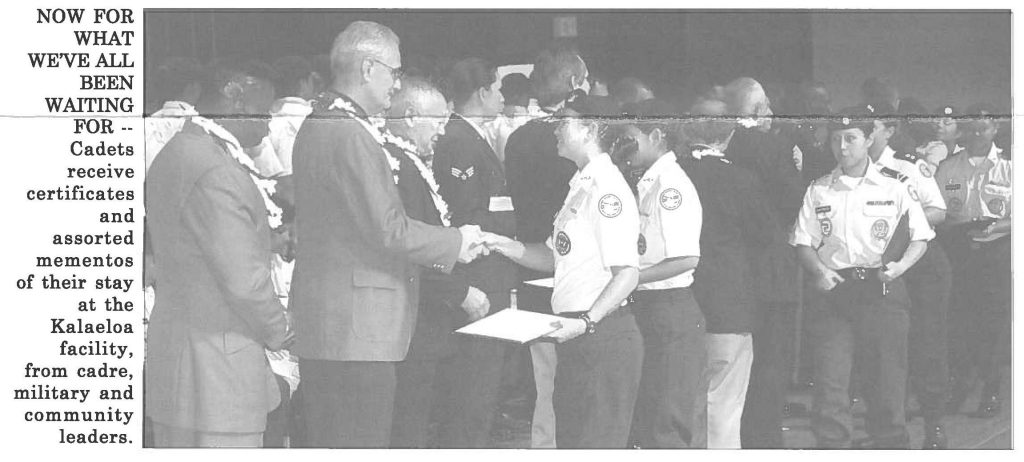 NOW FOR WHAT WE'VE ALL BEEN WAITING FOR -- Cadets receive certificates and assorted mementos of their stay at the Kalaeloa facility, from cadre, military and community leaders.