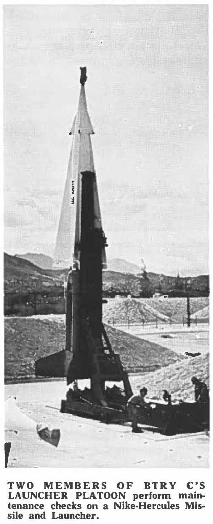 TWO MEMBERS OF BTRY C'S LAUNCHER PLATOON perform maintenance checks on a Nike-Hercules Missile and Launcher.