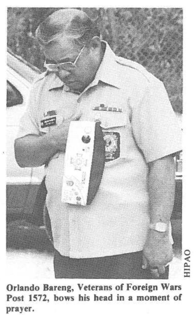 Orlando Bareng, Veterans of Foreign Wars Post 1572, bows his head in a moment of prayer.