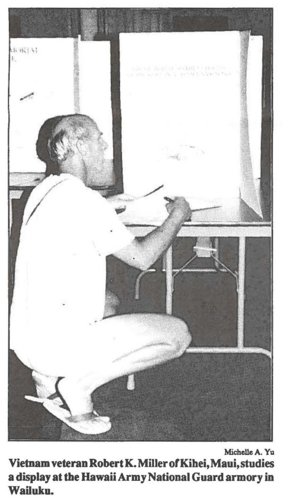 Vietnam veteran Robert K. Miller of Kihei, Maui, studies a display at the Hawaii Army National Guard armory in Wailuku.