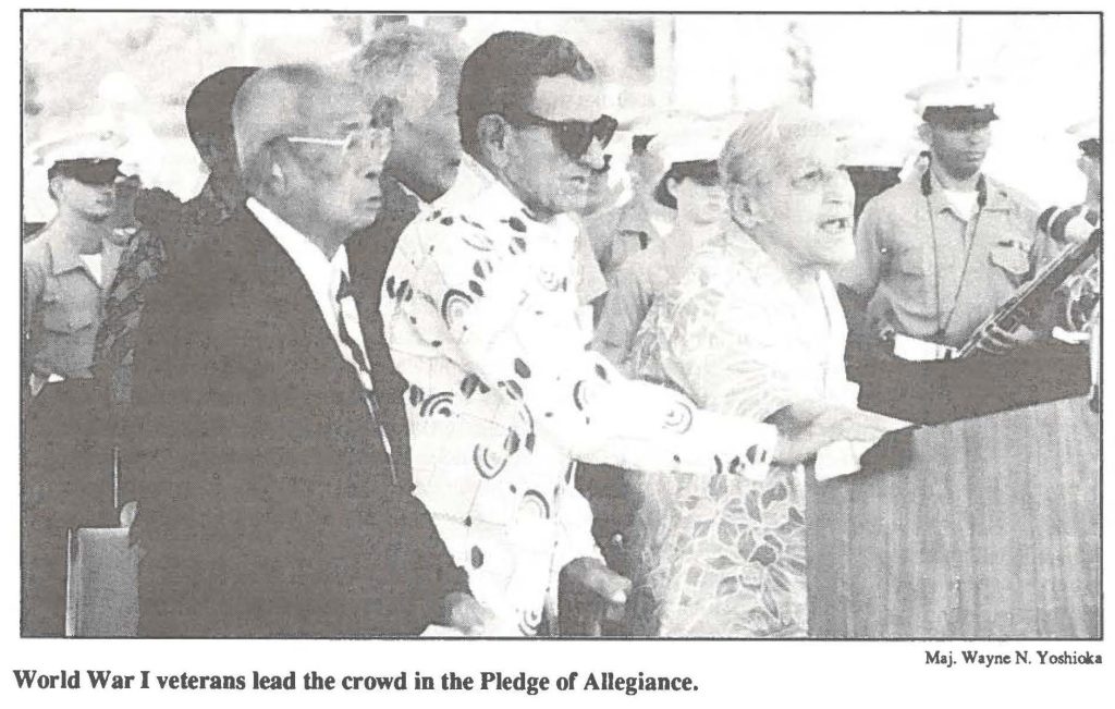 World War I veterans lead the crowd in the Pledge of Allegiance.