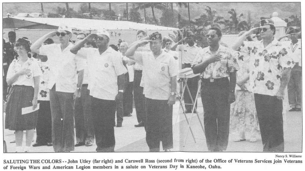 SALUTING THE COLORS - -John Utley (far right) and Carswell Ross (second from right) of the Office of Veterans Services join Veterans of Foreign Wars and American Legion members in a salute on Veterans Day Kaneohe, Oahu.