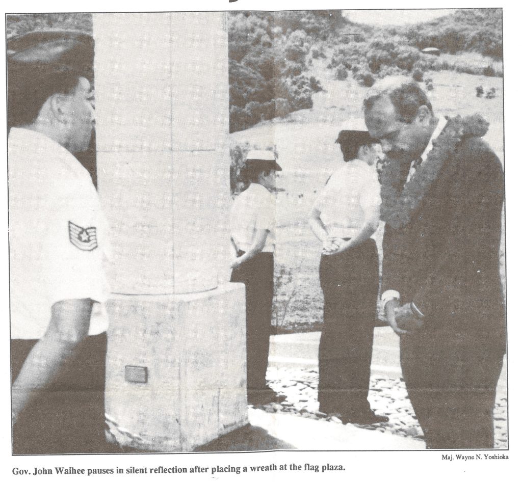 Gov. John Waihee pauses in silent reflection after placing a wreath at the flag plaza