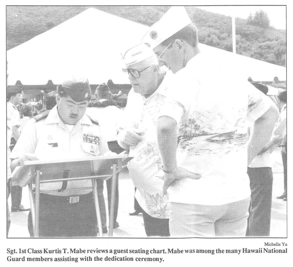 Sgt. 1st Class Kurtis T. Mabe reviews a guest seating chart. Mabe reviews a guest seating chart. Mabe was among the many Hawaii National Guard members assisting with the dedication ceremony.