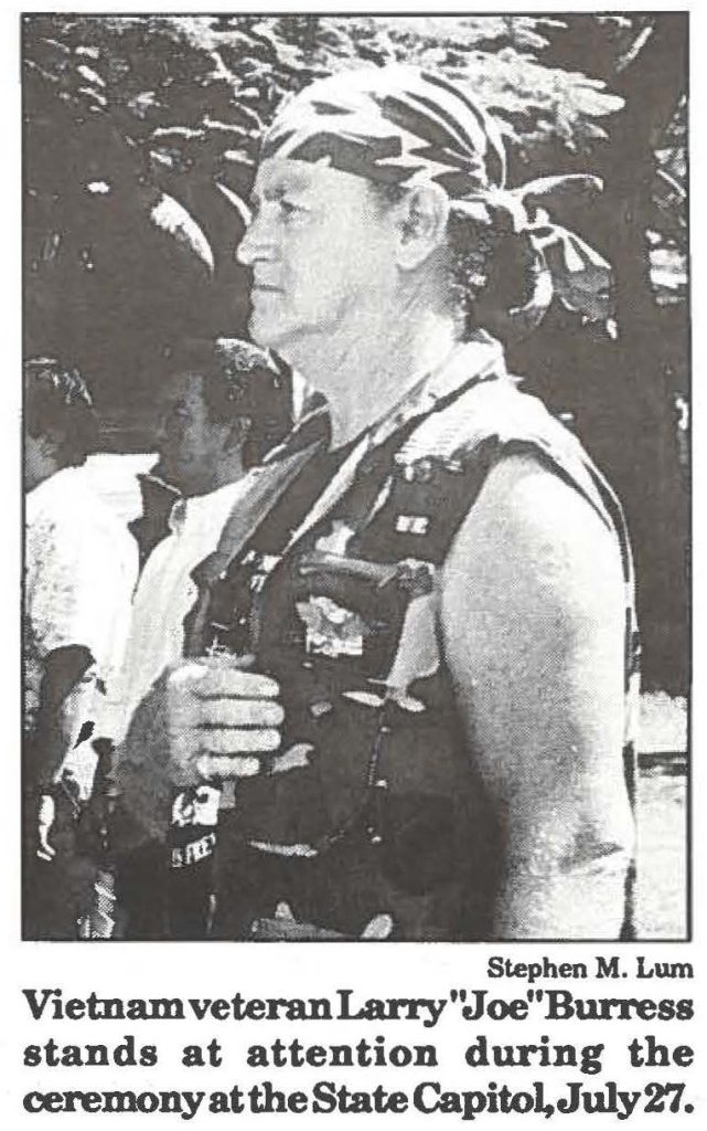 Vietnam veteran Larry "Joe" Burress stands at attention during the ceremony at the State Capitol, July 27.