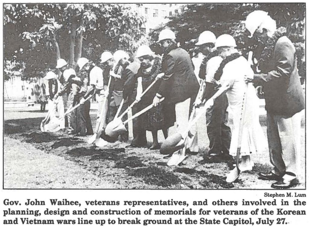Gov. John Waihee, veterans representatives, and others involved in the planning, design and construction of memorials for veterans of the Korean and Vietnam wars line up to break ground at the State Capitol, July 27.